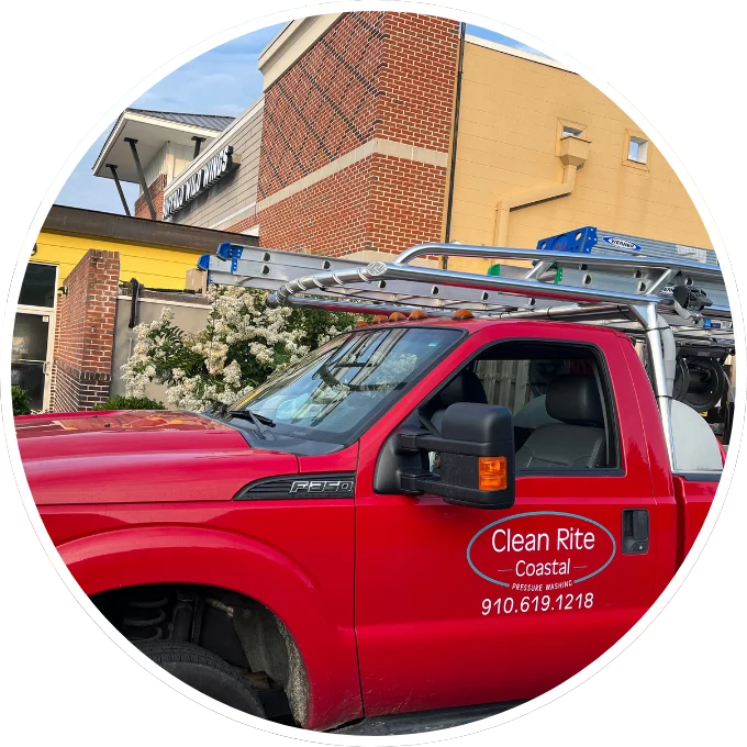 Commercial Service Truck Red Clean Rite truck with ladders parked near a brick building, advertising pressure washing Wilmington NC services.